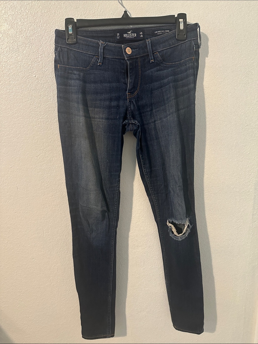Hollister Women's Dark Blue Skinny Jeans with Distressed Knee